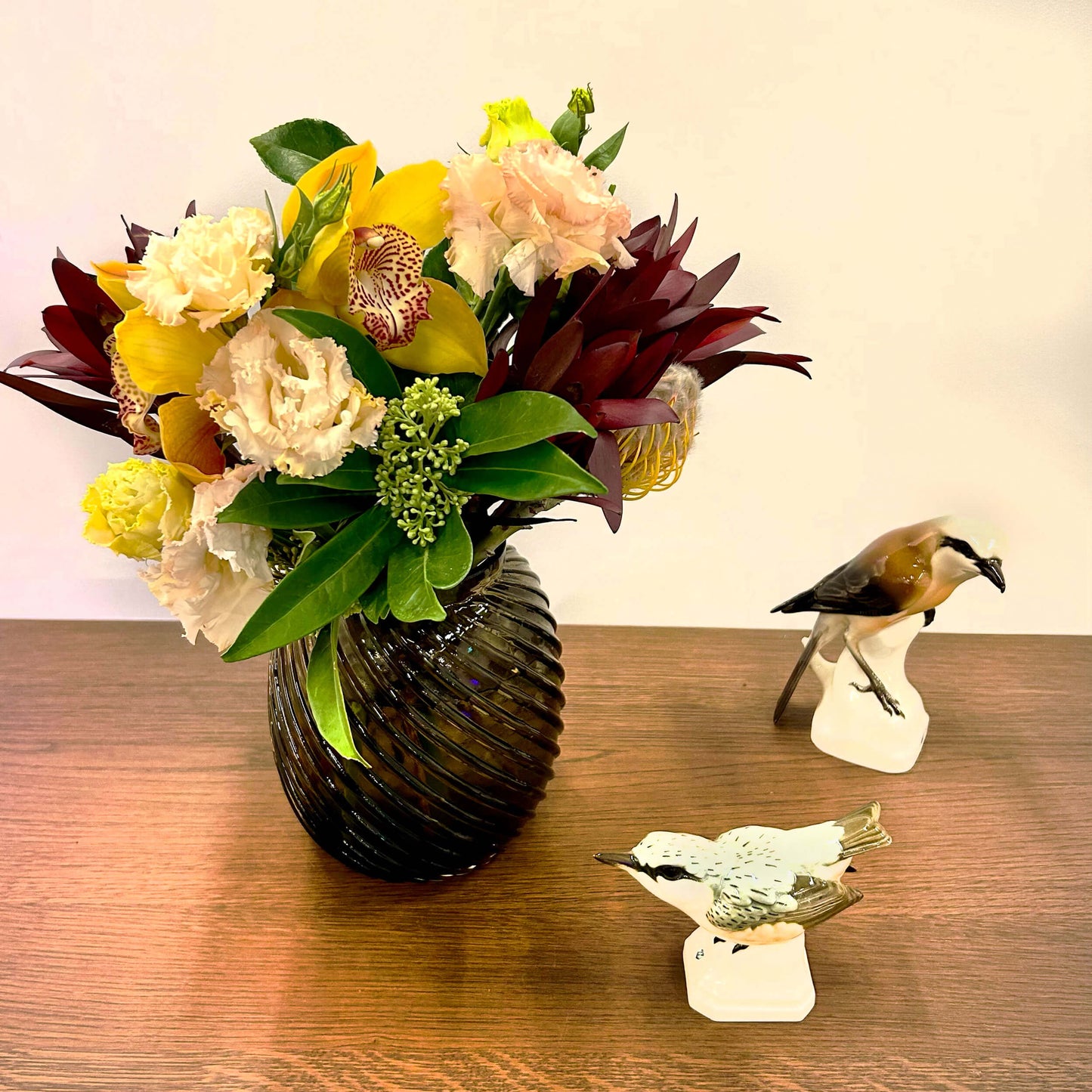 Small tabletop arrangement, greenery, yellows and soft pinks – for a workplace countertop, workplace weeklies for B2B flowers in Toronto, Quince Flowers – Toronto’s best B2B florist, available near you.
