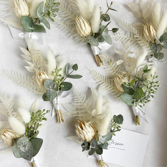 A collection of elegant boutonnieres. Order online for wedding & event flowers from the best florist in Toronto near you.