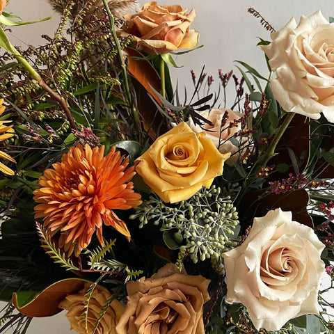 Earth tone flowers, oranges, golds, yellows and warm browns, roses, mums, and foliage, flower bouquet or arrangement, flower delivery from Quince Flowers