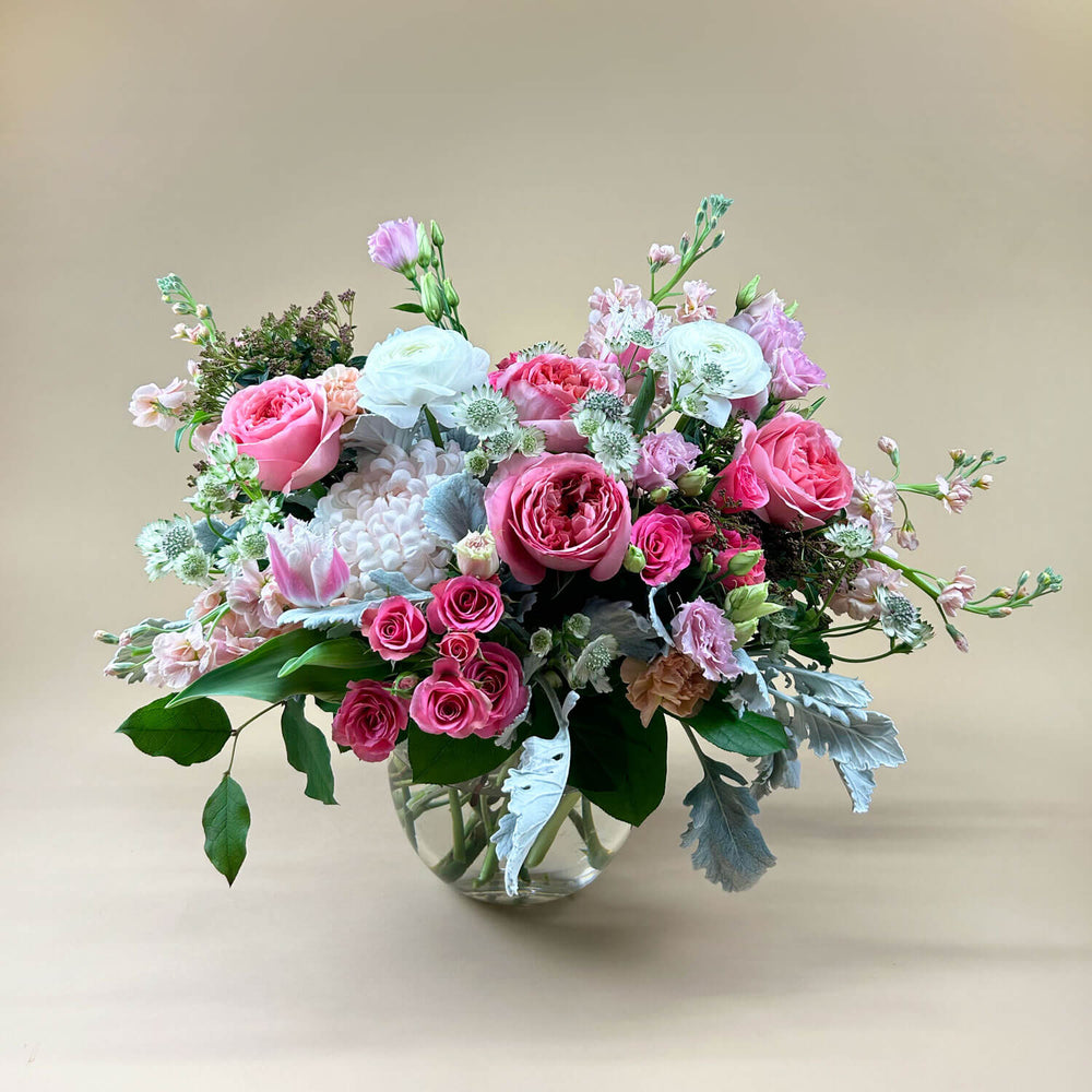 
                      
                        Image of a bouquet featuring airy pastel pink and delicate cream flowers, including a mix of white and pink roses, blush ranunculus, lisianthus, and carnations. Celebrate gender non-binary expression with this sweet palette. Order online for same-day flower delivery from Toronto's best florist, available near you.
                      
                    