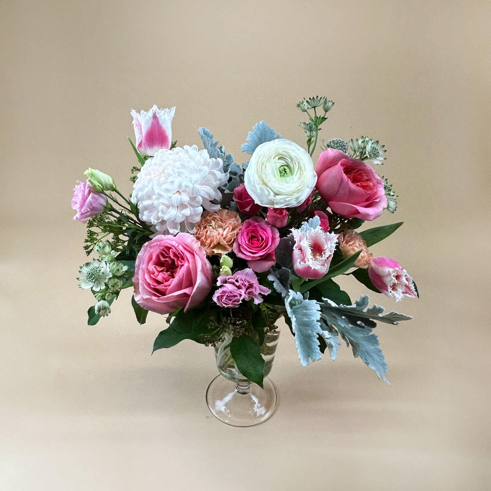 
                      
                        Image of a bouquet featuring airy pastel pink and delicate cream flowers, including a mix of white and pink roses, blush ranunculus, lisianthus, and carnations. Celebrate gender non-binary expression with this sweet palette. Order online for same-day flower delivery from Toronto's best florist, available near you.
                      
                    