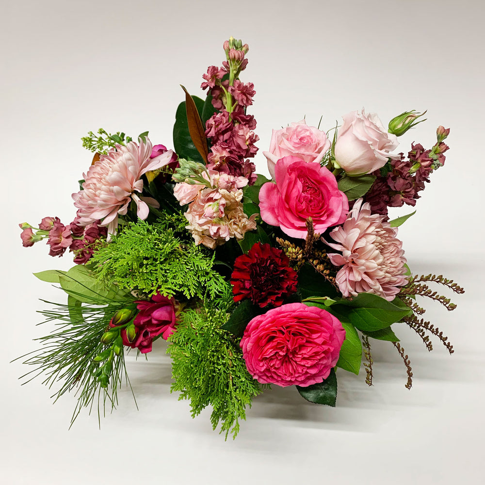 
                      
                        Image of a bouquet featuring punchy magenta, burgundy, blush, and wintergreens, creating a cozy and gender non-binary color story.Order online for same-day flower delivery from the best florist in Toronto near you.
                      
                    