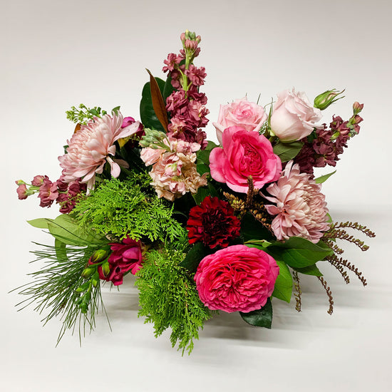 Load image into Gallery viewer, Image of a bouquet featuring punchy magenta, burgundy, blush, and wintergreens, creating a cozy and gender non-binary color story.Order online for same-day flower delivery from the best florist in Toronto near you.
