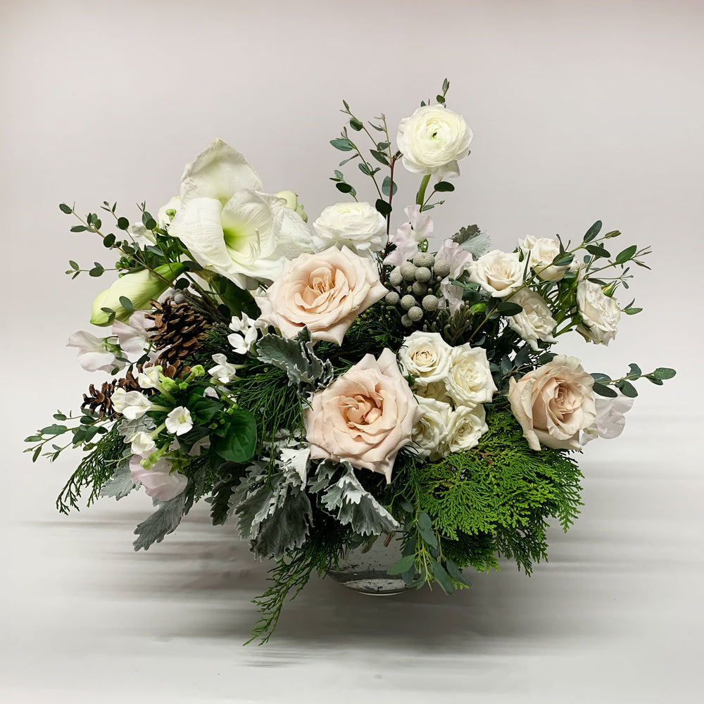 
                      
                        Image of a bouquet featuring shades of linen, off-white, palest pink, winter greens, and eucalyptus, with silver foliage. Order online for same-day flower delivery from the best florist in Toronto near you.
                      
                    