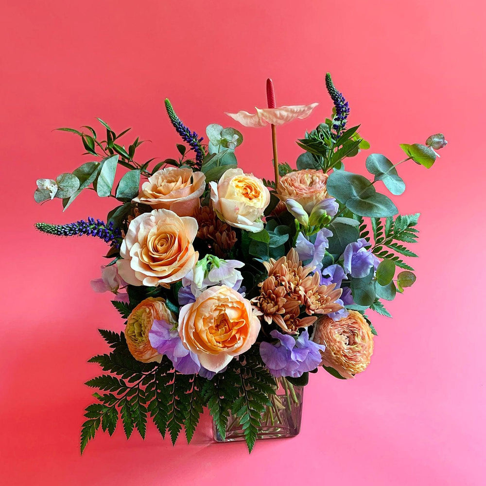 
                      
                        Image of a bouquet with sweet peach and apricot tones, deepening to lavender and blue, with a touch of foliage for freshness. Order online for same-day flower delivery from Toronto's best florist, available near you.
                      
                    