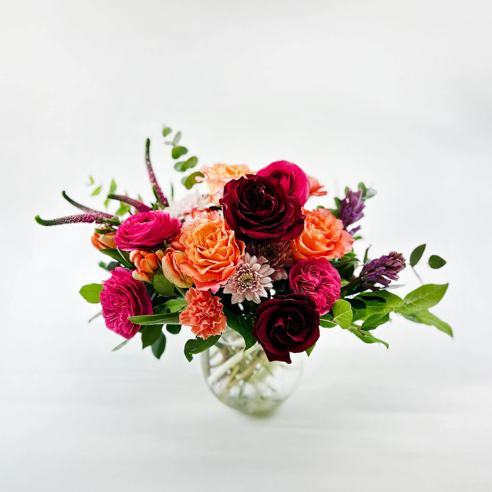 
                      
                        Image of a daring bouquet featuring spring flowers and roses, including hyacinth, tulips, hot pink ranunculus, veronica, lisianthus, and blush hydrangea. Order online for same-day flower delivery from Toronto's best florist, available near you.
                      
                    