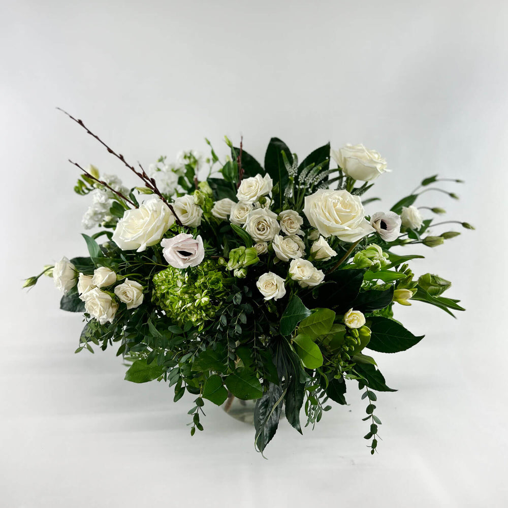 
                      
                        Image of a romantic bouquet featuring cream and white flowers, including garden roses, parrot tulips, freesia, and ranunculus. Order online for same-day flower delivery from Toronto's best florist, available near you.
                      
                    