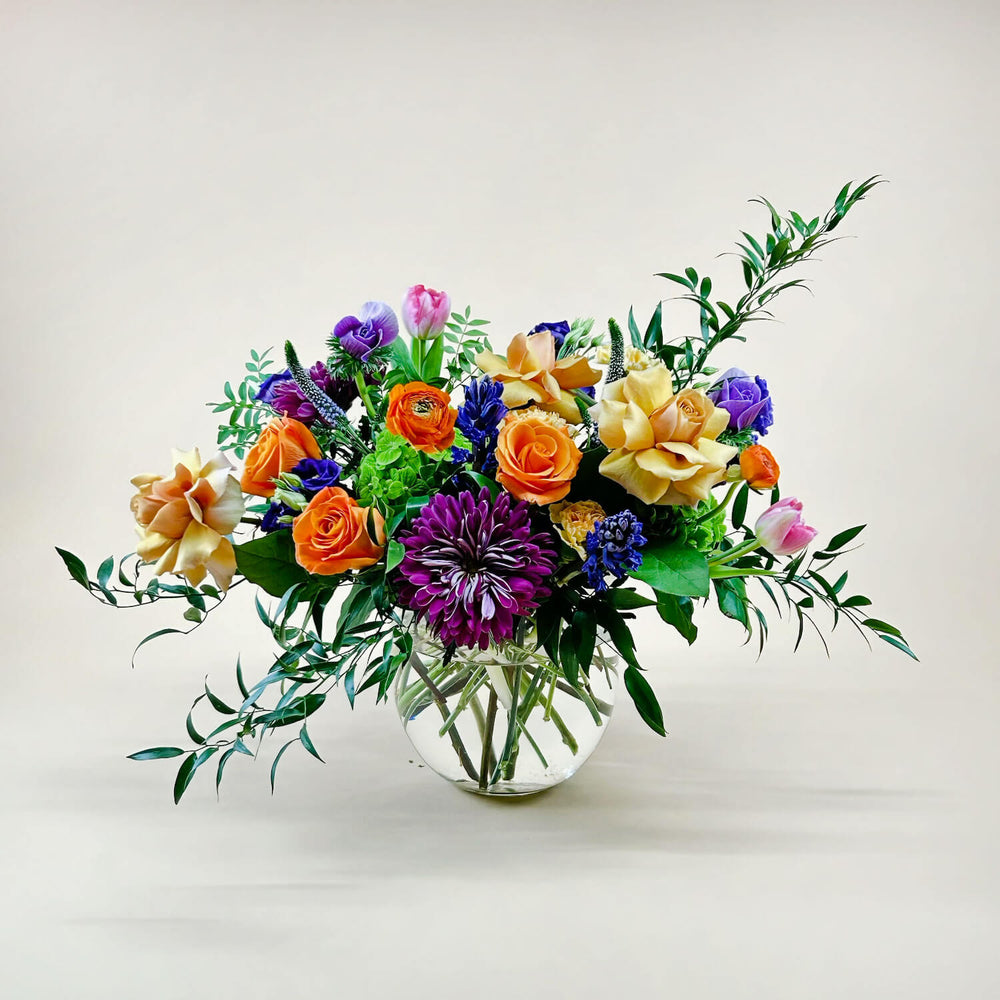 
                      
                        Image of a dynamic bouquet featuring yellow and lavender hues transitioning into deeper purple tones, with accents of citrus orange for vibrancy. A thoughtful and romantic combination. Order online for same-day flower delivery from Toronto's best florist, available near you.
                      
                    