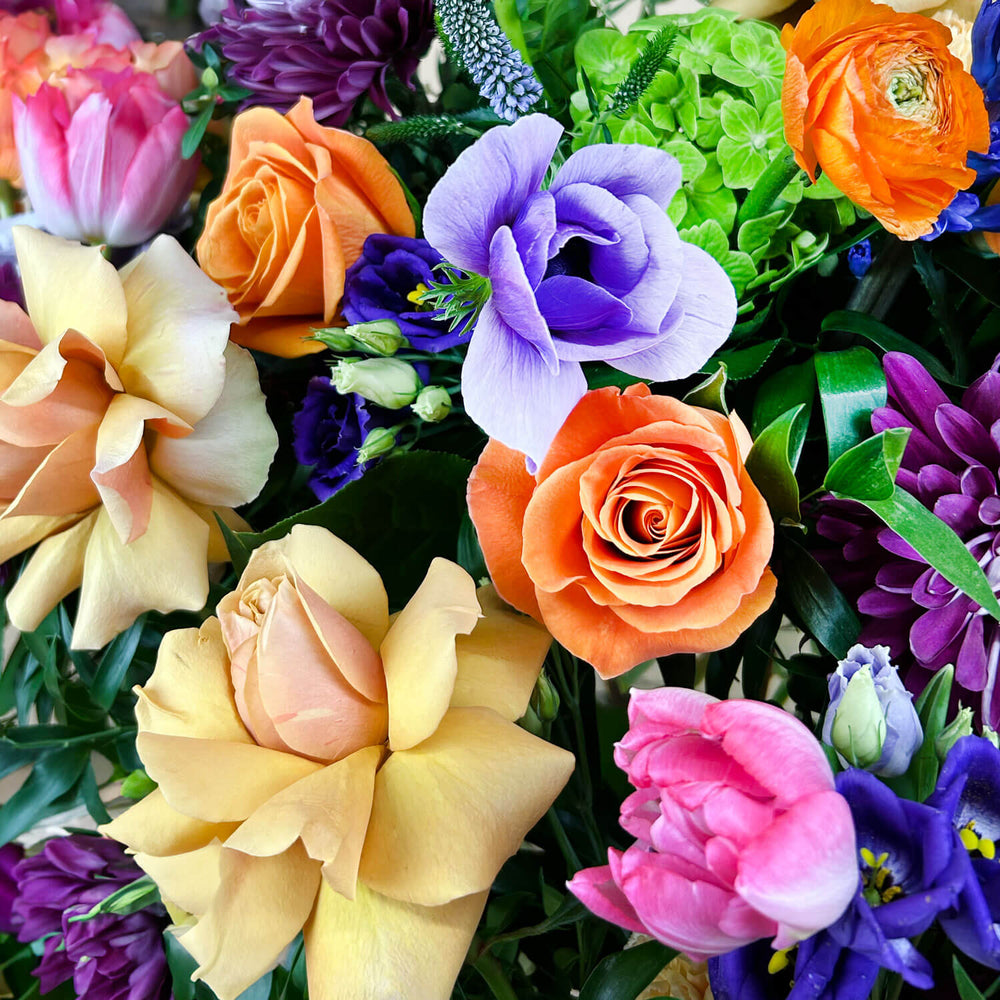 
                      
                        Close-up image of a dynamic bouquet featuring yellow and lavender hues transitioning into deeper purple tones, with accents of citrus orange for vibrancy. A thoughtful and romantic combination. Order online for same-day flower delivery from Toronto's best florist, available near you.
                      
                    