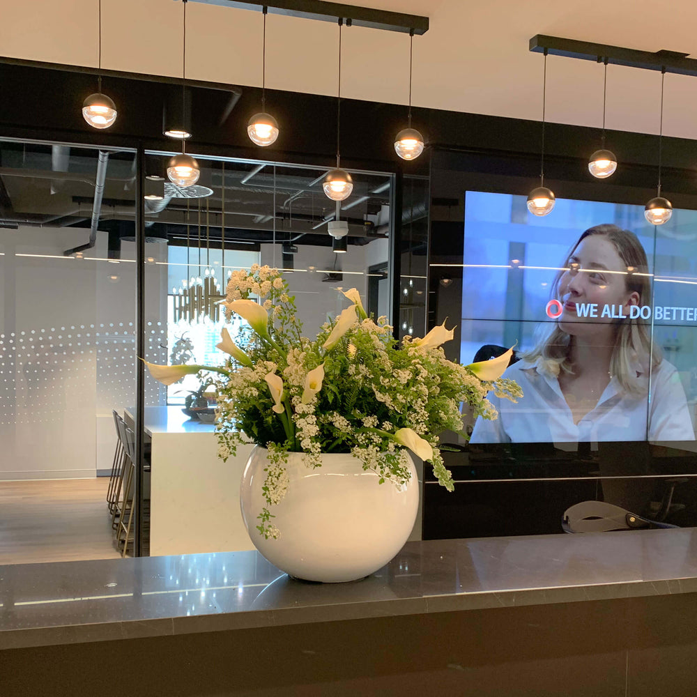 
                      
                        Large entrance flower arrangement on a workplace countertop, workplace weeklies for B2B flowers in Toronto, Quince Flowers – Toronto’s best florist, available near you.
                      
                    