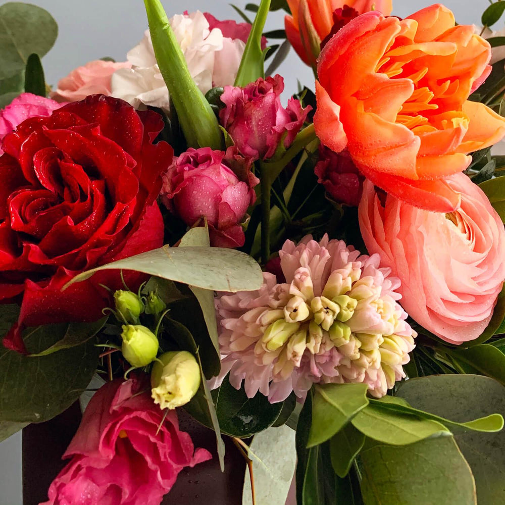 Image of vibrant flowers in saturated tones, delivering cheer and inspiration. Order online for same-day flower delivery from the best Toronto florist, available near you.