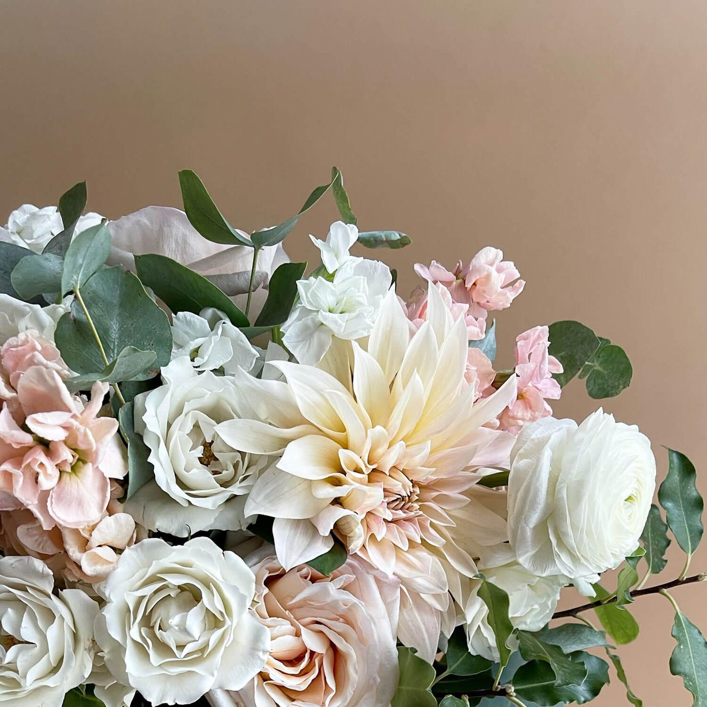 Image of contemporary flower bouquet featuring warm whites with a hint of blush, perfect for elevating romance. Order online for same-day flower delivery from Toronto's best florist, available near you.