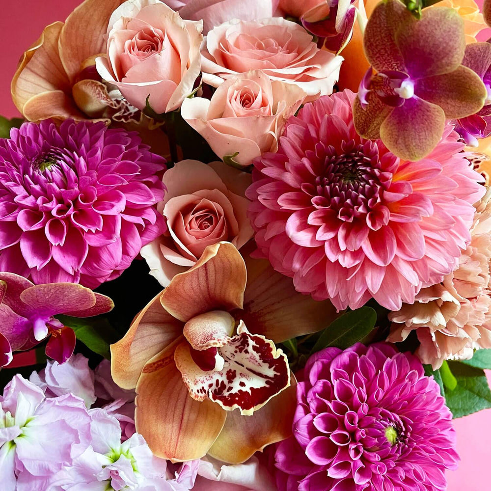 
                      
                        Close-up image of a bouquet featuring radiant colors including pink, orange, and pongee flowers, creating a daring and inspired palette.  Order online for same-day flower delivery from Toronto's best florist, available near you.
                      
                    