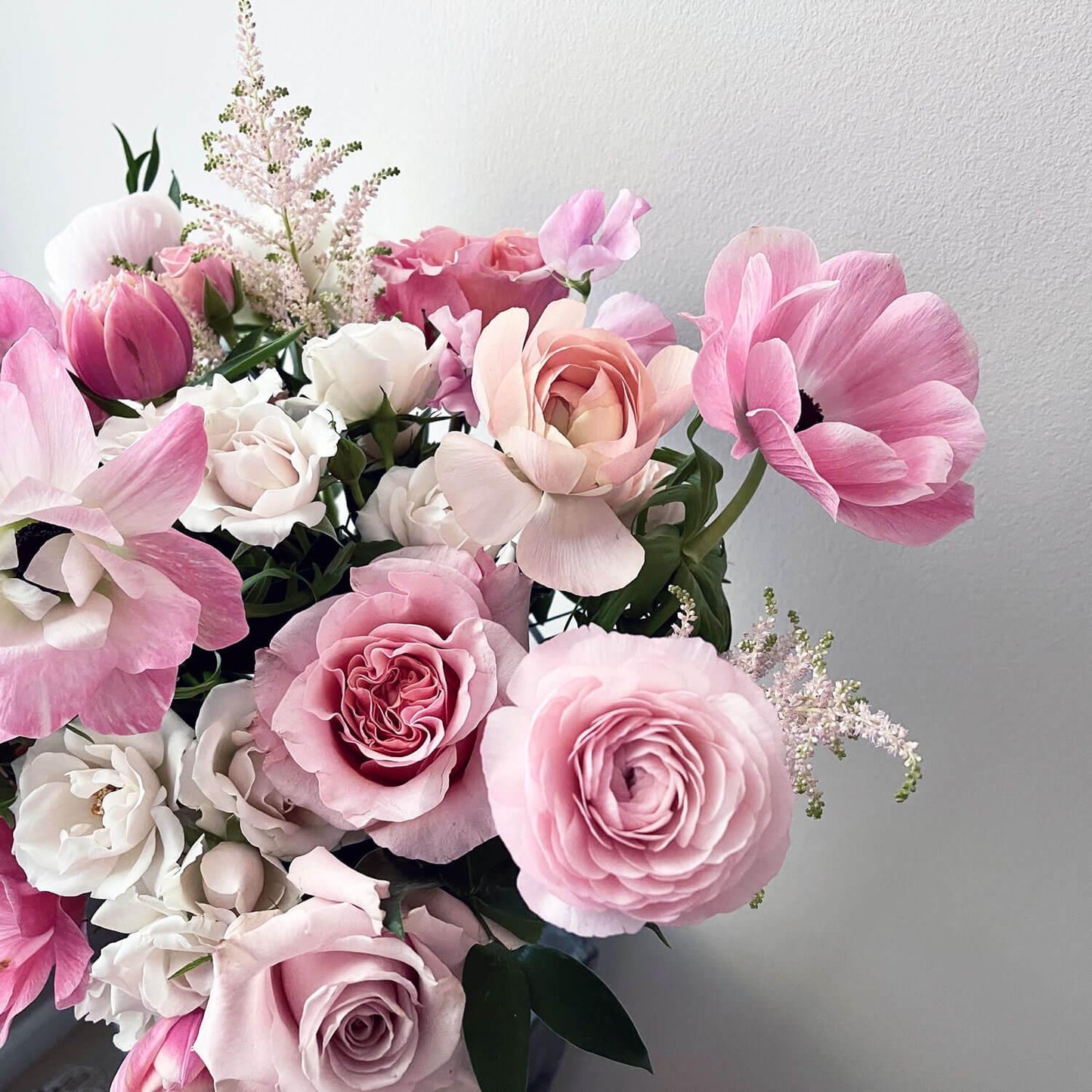 Image of airy pastel pink and delicate cream flowers, evoking a sweet and gender non-binary color story.Order online for same-day flower delivery from Toronto's best florist, available near you.