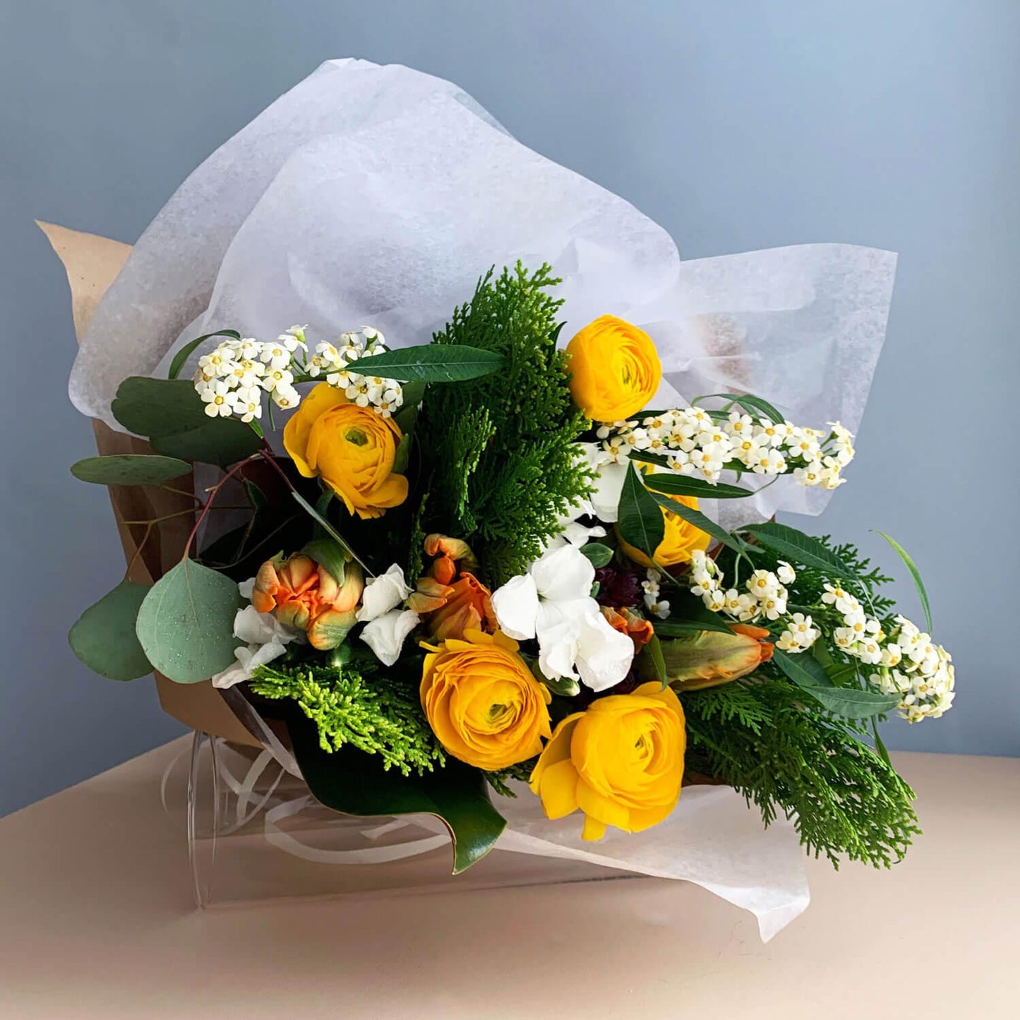 Wonderblooms monthly flower subscription from Quince Flowers, Toronto Florist and flower delivery - yellow white and green bouquet of flower with ranunculus and foliage. Order online for flower & plant subscriptions from the best florist in Toronto near you.