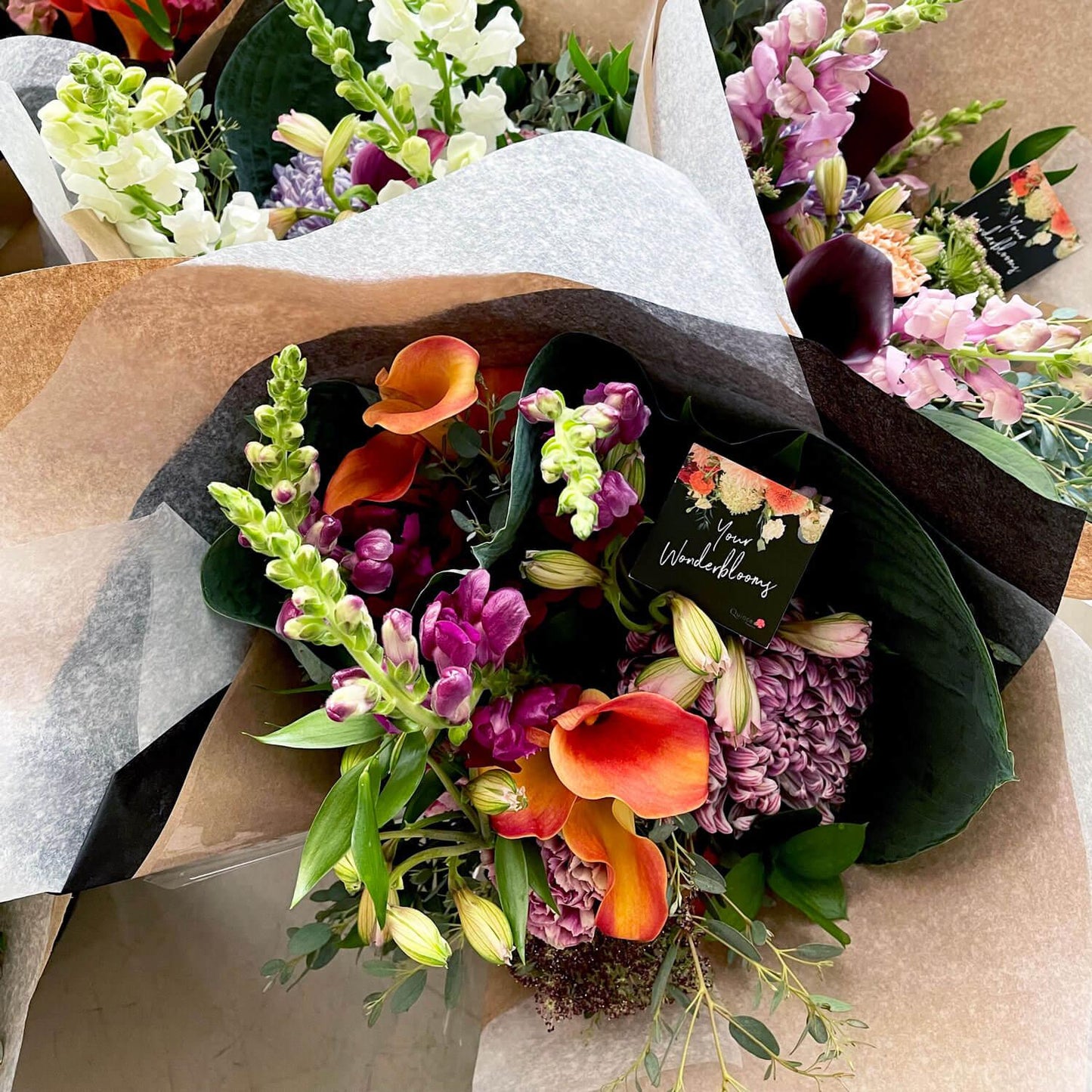Wonderblooms monthly flower subscription from Quince Flowers, Toronto Florist and flower delivery - bouquet of flowers with calla lilies, colour flower bouquet. Order online for flower & plant subscriptions from the best florist in Toronto near you.