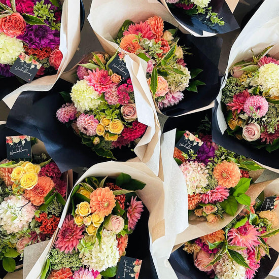 Wonderblooms monthly flower subscription from Quince Flowers, Toronto Florist and flower delivery - many bouquets of flowers shot from above, colour flower bouquets. Order online for flower & plant subscriptions from the best florist in Toronto near you.