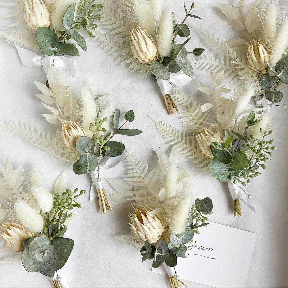
                      
                        A collection of elegant boutonnieres. From the best wedding florist in Toronto Quince Flowers.
                      
                    