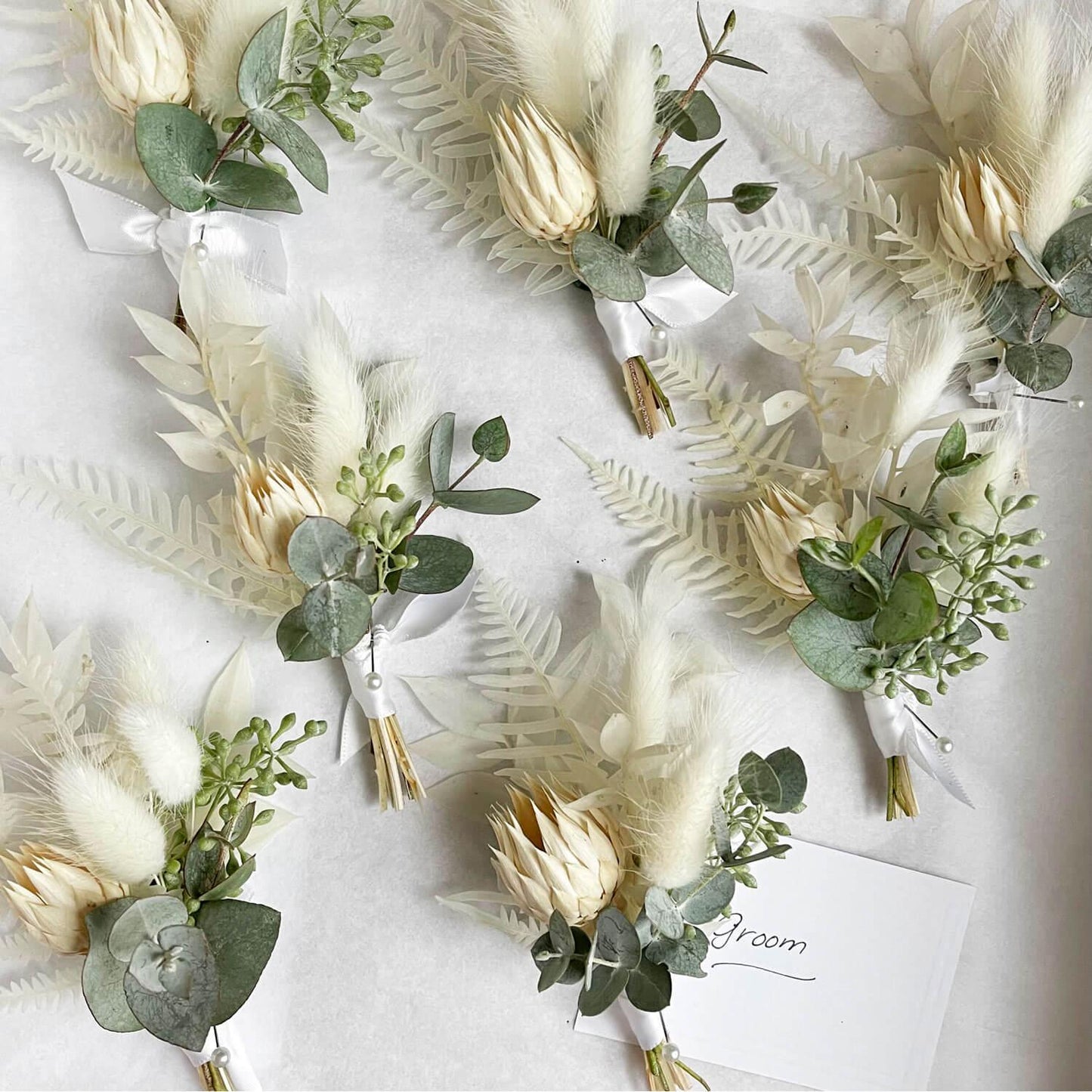 Load image into Gallery viewer, A collection of elegant boutonnieres. Order online for wedding &amp;amp; event flowers from the best florist in Toronto near you.

