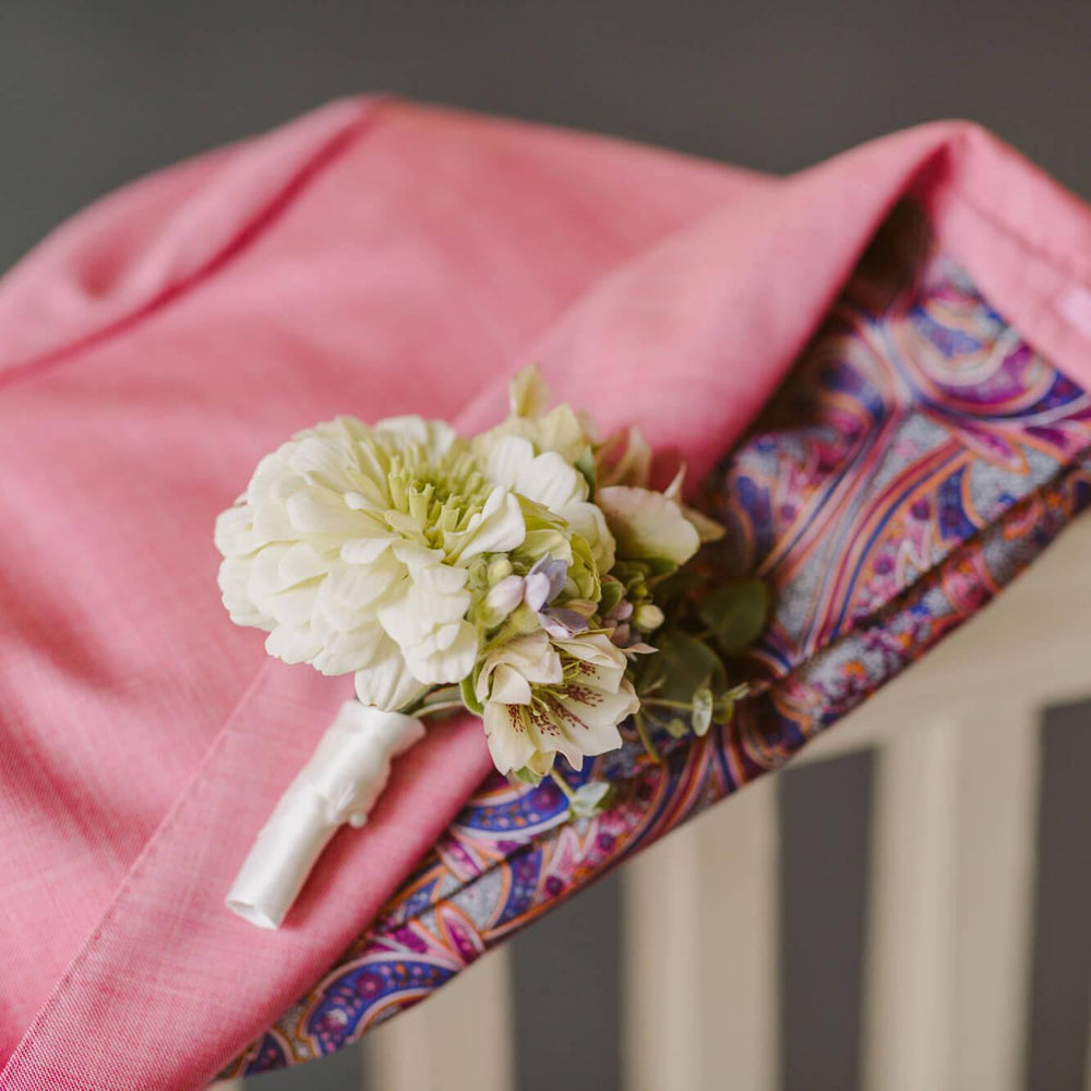 
                      
                        Elegant boutonniere made of white flowers and green leaves, From the best wedding florist in Toronto Quince Flowers.
                      
                    