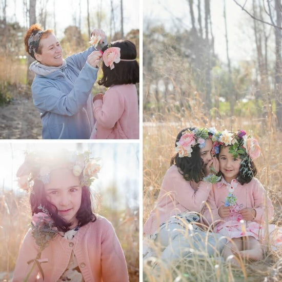 A collage of four images capturing two individuals in an outdoor setting with tall grass and bare trees in the background. Their faces are obscured for privacy. In the top left image, one individual is placing a flower behind the ear of the other. The top right image shows them sitting amidst tall grass. The bottom images focus on one individual adorned with flowers. Order online for wedding & event flowers from the best florist in Toronto near you.